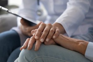 doctor comforting a patient’s daughter