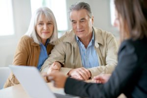 older couple-going-over-their-finances-with-their-advisor